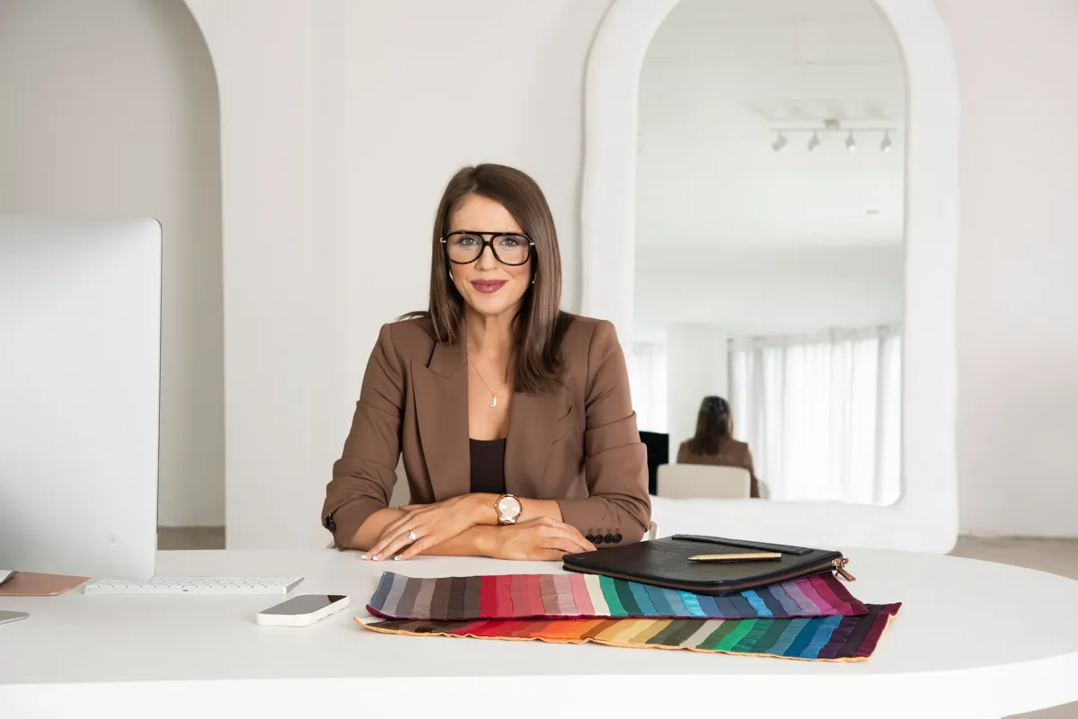 Josephine Eve at her desk with professional colour analysis drapes and swatches