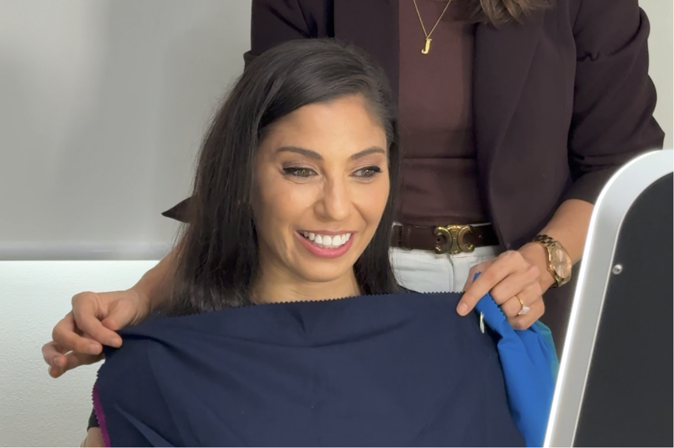 Colour draping session showing deep navy as a harmonising colour for the client's complexion