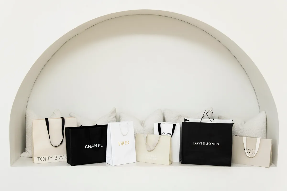 Designer shopping bags from Chanel, Dior, Celine and David Jones — investing in a quality work wardrobe